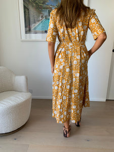 Created using the finest block printing techniques, the Georgia Dress in Golden Glow offers an elegant silhouette with a belted waist, mid length tailored sleeves and collared neckline to be worn open or buttoned all the way. She's flirtatious and fun, and very cool to wear when the temperature spikes. 