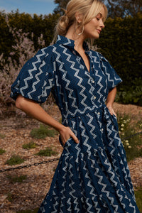 The Amelie dress offers a beautiful summer dress for all occasions. Lunches out or dinners in. She can be cinched in at the waist or left loose with a dropped waistline. Pockets and puffed sleeves… Yes, always and forever. Block printed by hand on 100% soft cotton.