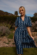 Load image into Gallery viewer, The Amelie dress offers a beautiful summer dress for all occasions. Lunches out or dinners in. She can be cinched in at the waist or left loose with a dropped waistline. Pockets and puffed sleeves… Yes, always and forever. Block printed by hand on 100% soft cotton.