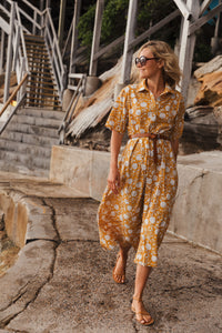 Created using the finest block printing techniques, the Georgia Dress in Golden Glow offers an elegant silhouette with a belted waist, mid length tailored sleeves and collared neckline to be worn open or buttoned all the way. She's flirtatious and fun, and very cool to wear when the temperature spikes. 